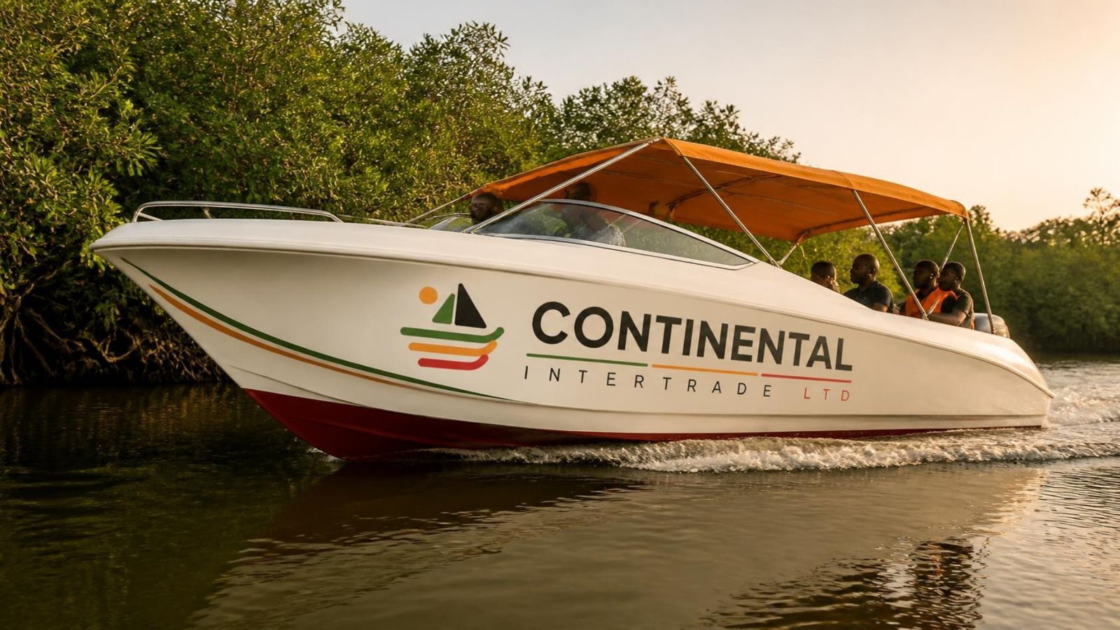 A Continental Intertrade passenger boat in brand livery cruising through a mangrove creek